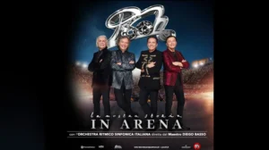 I Pooh in concerto sul palco dell'Arena di Verona durante un evento live serale, un'esperienza indimenticabile per gli ospiti dell'Albergo Fontana appassionati di musica.